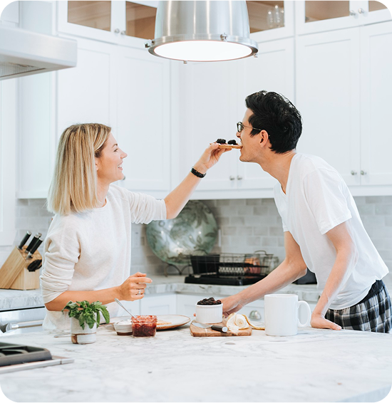 Photo of a couple enjoying their new kitchen remodel