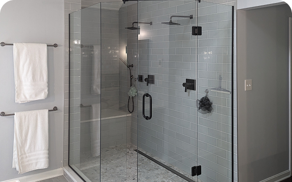 Bathroom remodel photo with walk-in shower and seating